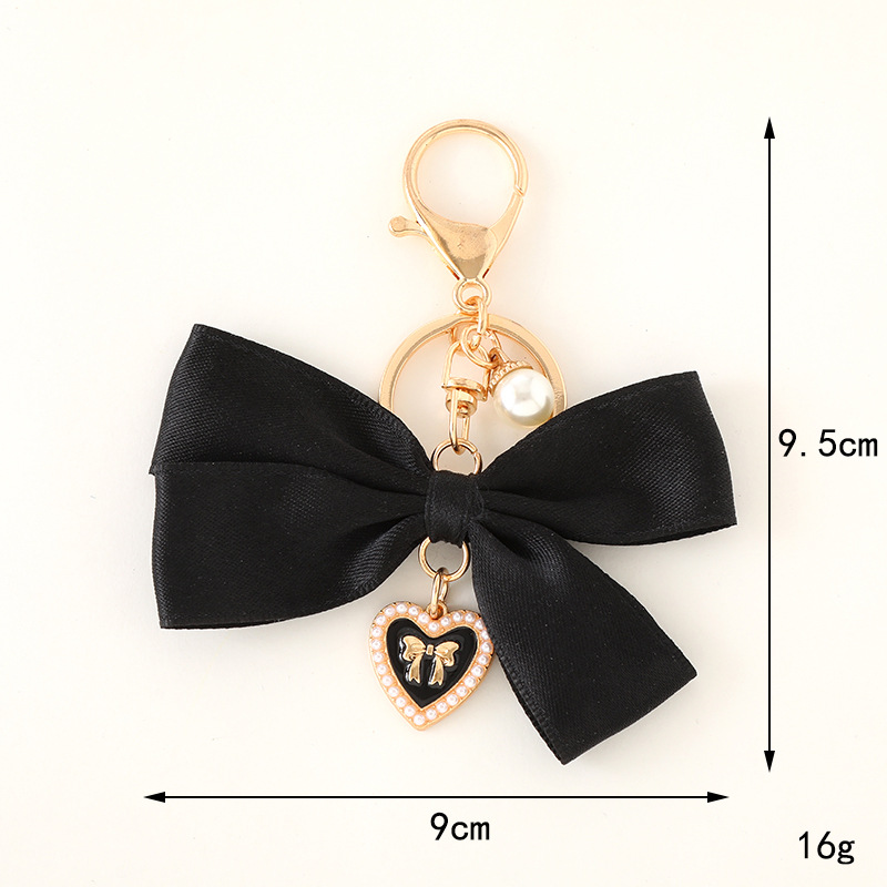 Stoffband-Schleifenanhänger, s – Women Bags Ysl Bewertung und Preis